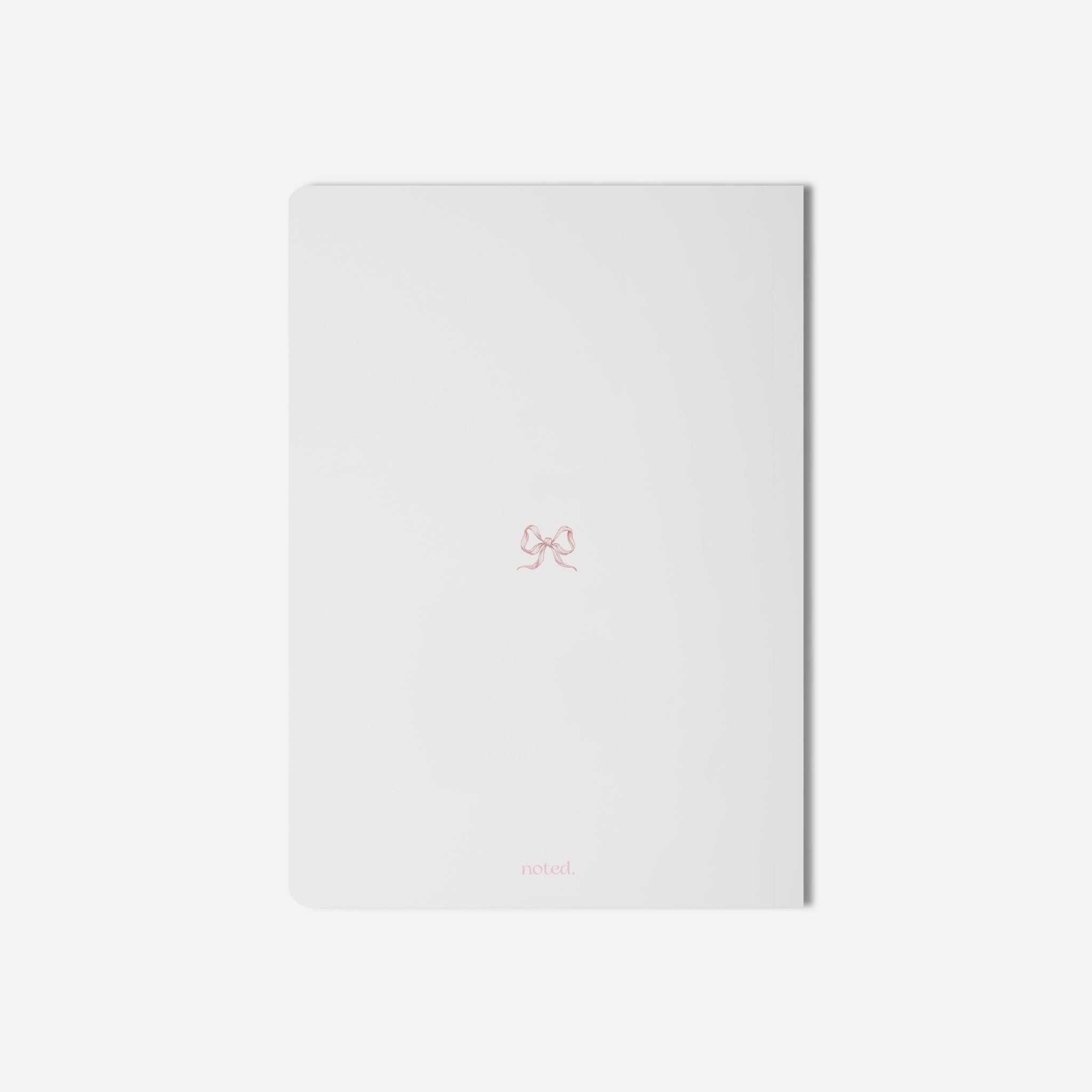 coquette-inspired notebook with bow detail — perfect for journaling and student planners