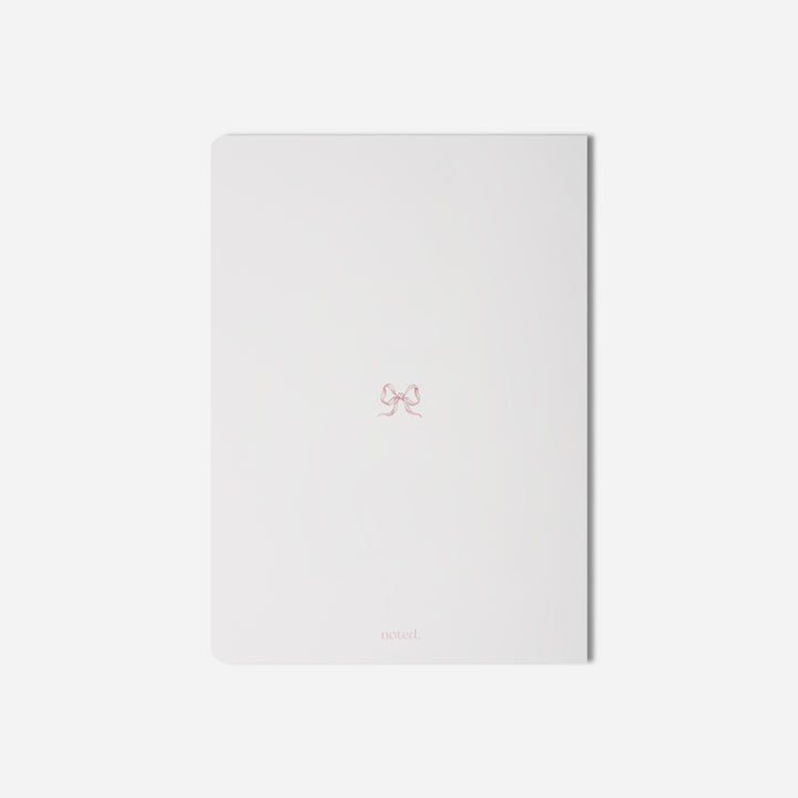 coquette-inspired notebook with bow detail — perfect for journaling and student planners