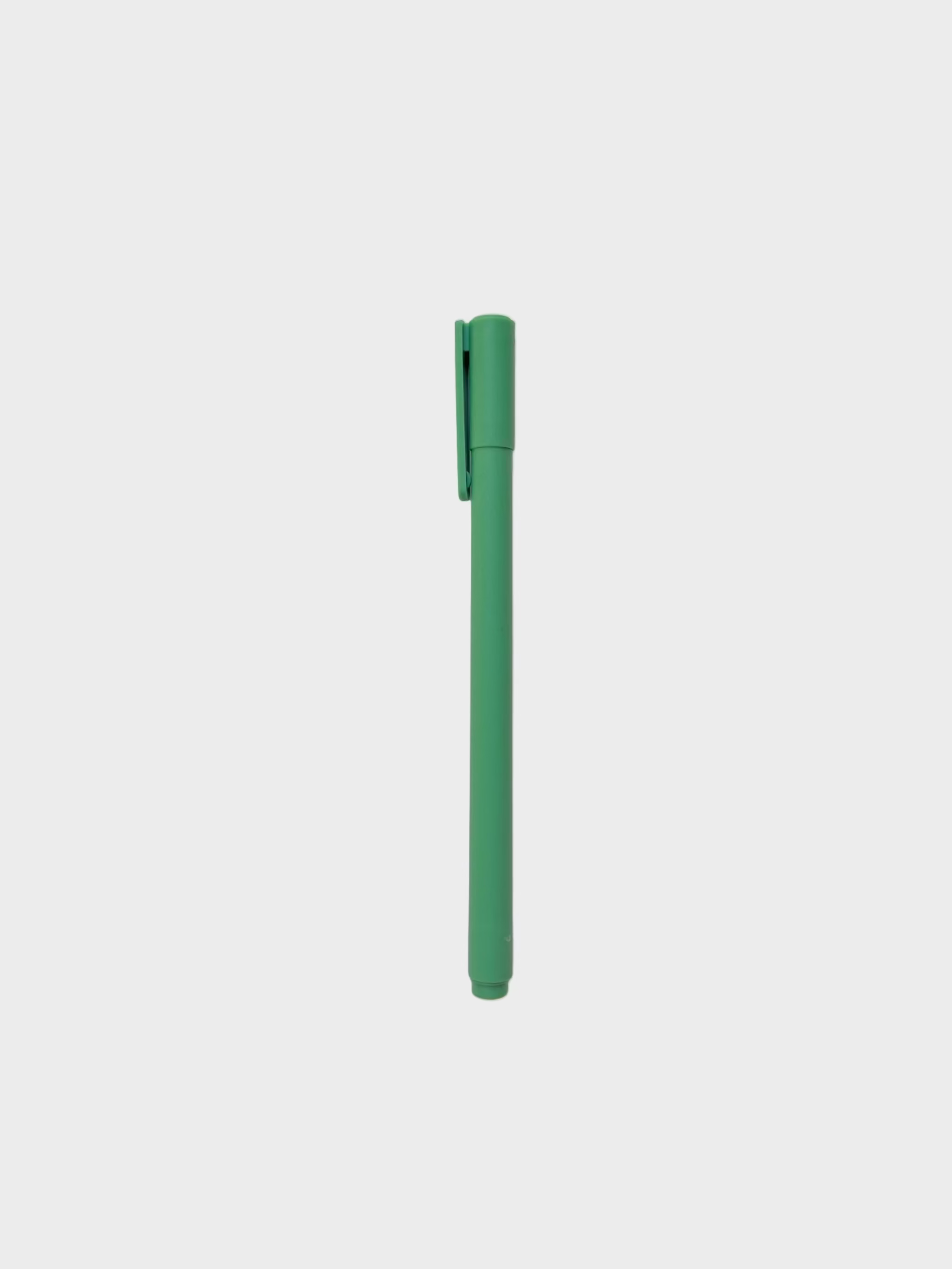 Green pen on a white background